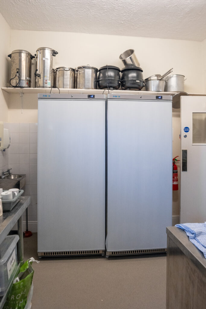 Two large fridges side by side